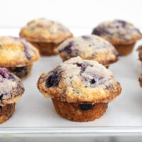 blueberry muffins on a sheet pan