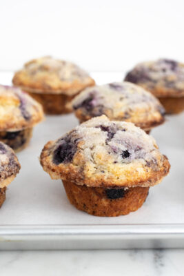 blueberry muffins on a sheet pan