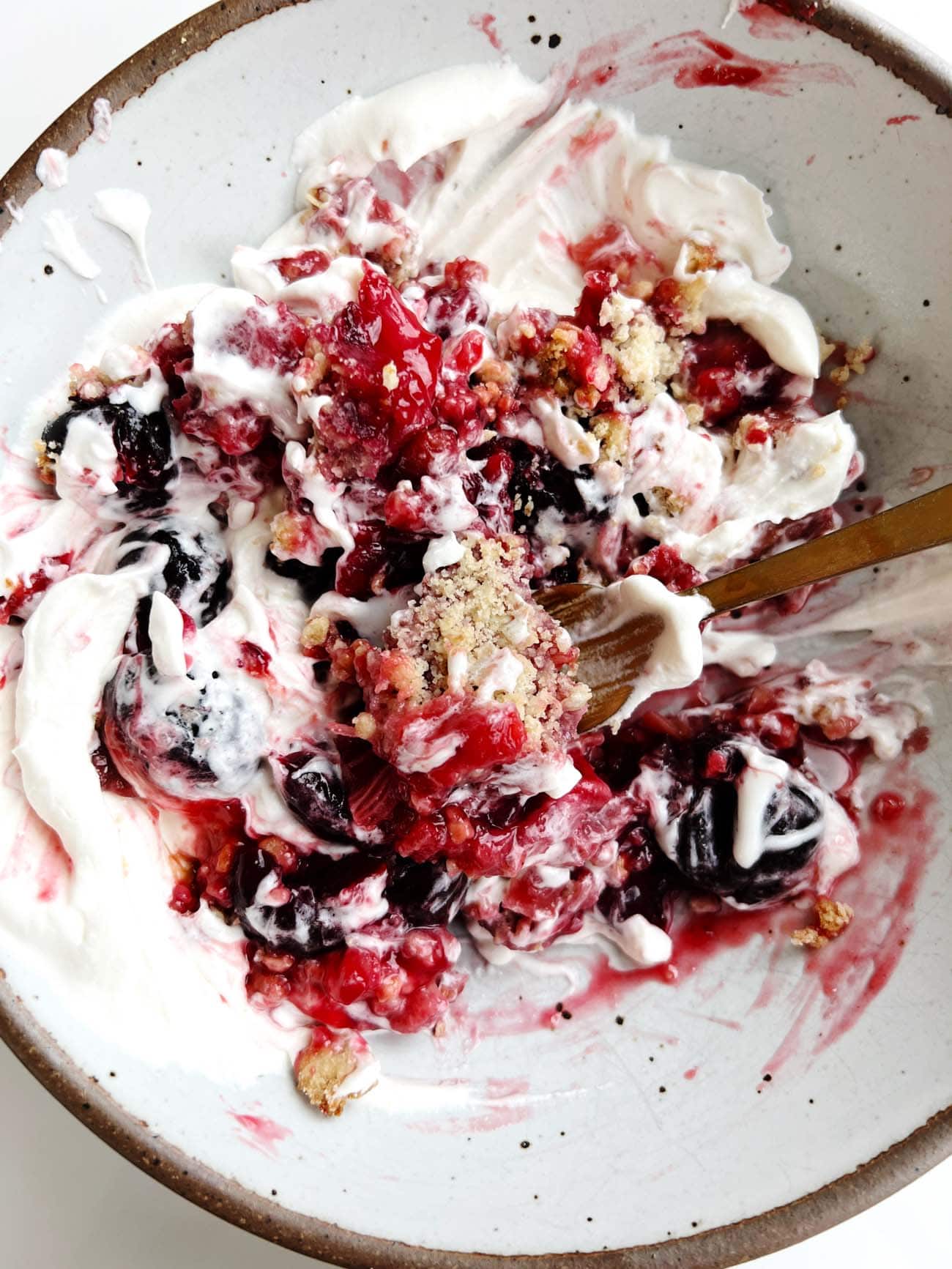 cherry rhubarb crisp mixed together in a bowl