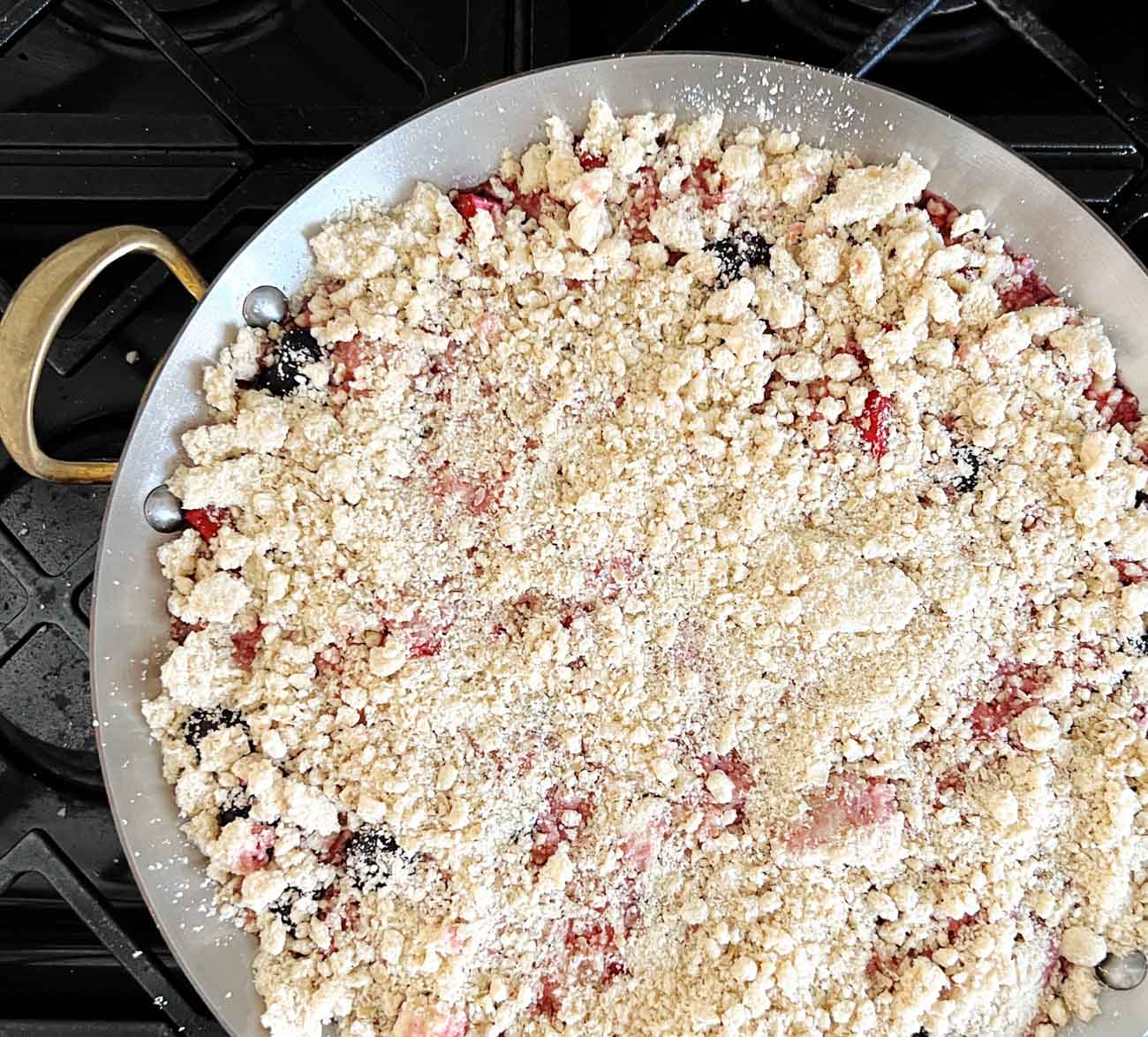 fruit crisp in a braiser before baking