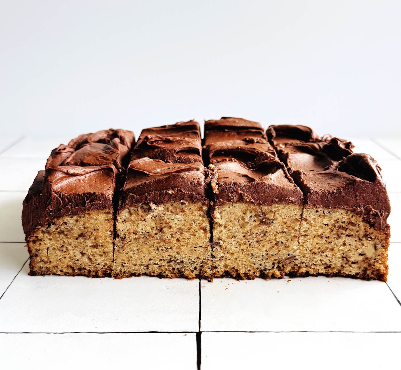 banana bread fudge bars on white backdrop