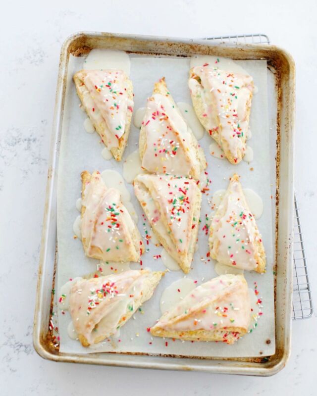 *New*! Sprinkle Scones with Icing; just for fun and really delicious. They’re soft, tender, and coated in icing. Sprinkles are inside the dough and on top. ❤️

I have two little nieces whose eyes light up at the sight of rainbow specks on pretty much anything, so I came up with this variation on my original scone recipe to keep my favorite Auntie status 😇

Link to the recipe in my profile!

____________
#sconesrecipe #bakingathome #bakingrecipes #bakingblog