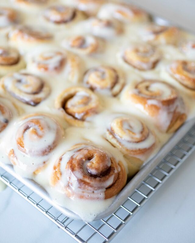 New! Soft & Gooey Mini Cinnamon Rolls;  so little ones can grab one and be satisfied, and growing teenagers and grandparents can sneak back and take seconds and thirds with plenty to spare. Thirty-six small buns all tucked into a pan, their tender base baking into each other to create pillow-like dough, and their cinnamon centers expanding into beautiful golden-brown spirals. Finished with a generous amount of cream cheese icing.

I spent a lot of time developing this recipe, as I found the filling to bun ratio took some experimenting. I use my Sweet Dough recipe for these smaller buns, and after many tries, found splitting the dough into three pieces, then rolling each piece out into separate logs (which are then cut into twelve pieces each) made for the perfect dough-to-filling ratio.

Link to the recipe in my profile! 

____________
#cinnamonroll #weekendbaking #creamcheeseicing #bakingbread
